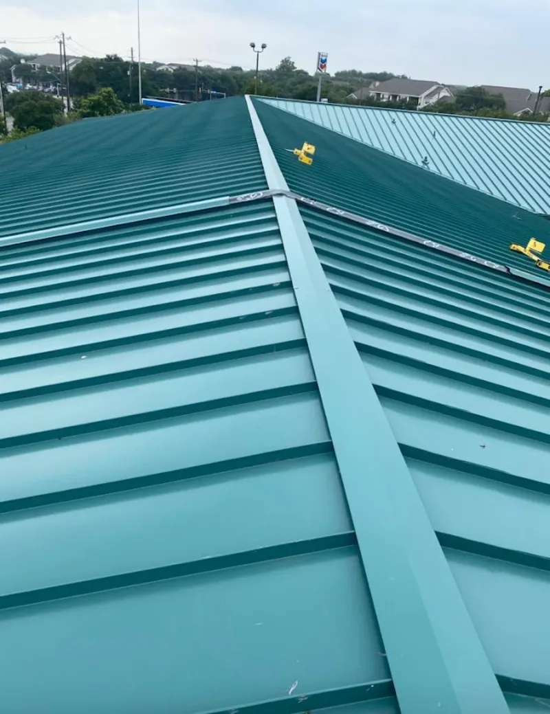 Green commercial metal roof ridge and valley for Metal Roof Repair in Avondale